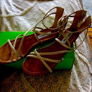 Steve Madden gold strappy sandals.